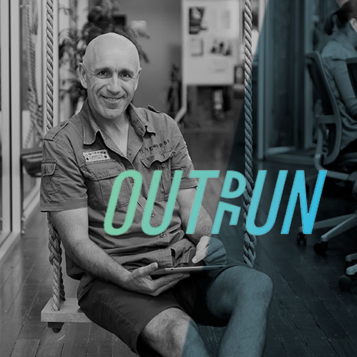 Image of Outrun founder Rob Gordon, with OUTRUN logo in green to blue gradient overlaid over the image